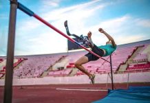Paralympic athlete clearing a high jump bar during training, a symbolic image for Oleg Boyko's article on steady social commitment.