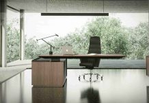 Right Office Furniture Selection Guide: modern executive desk and ergonomic chair in a minimalist, well-lit office workspace