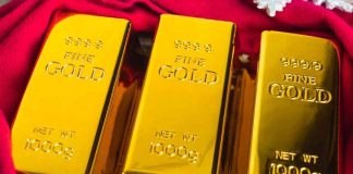 Gold as a Macro Signal, 999.9 fine gold bars reflecting global macro trends, real yields, and inflation expectations in 2026 markets