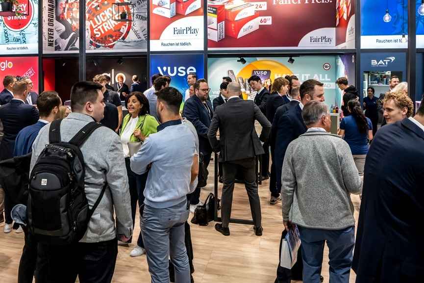 InterTabac tobacco industry trade show visitors networking and exploring tobacco, vape, and smoking accessory exhibits.