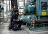 Why UAE businesses are rethinking facility management Outsourced Facility Management UAE technician inspecting industrial equipment
