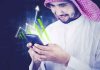 Why Saudi Arabia is rising in Crypto and Blockchain Saudi investor using a smartphone for Crypto and Blockchain in Saudi Arabia
