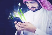 Why Saudi Arabia is rising in Crypto and Blockchain Saudi investor using a smartphone for Crypto and Blockchain in Saudi Arabia