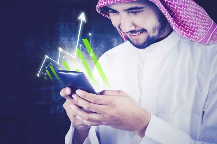 Saudi investor using a smartphone for Crypto and Blockchain in Saudi Arabia
