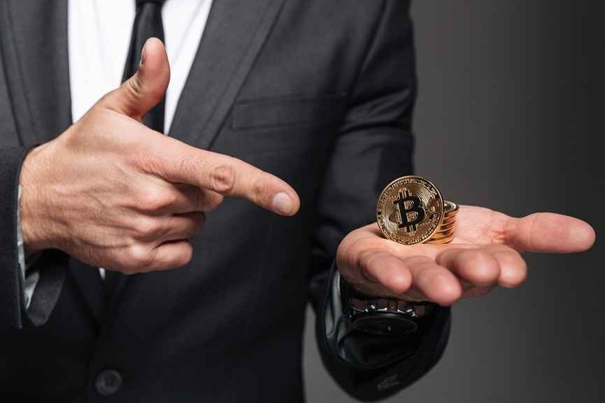 Businessman presenting Bitcoin, representing Crypto and Blockchain in Saudi Arabia.